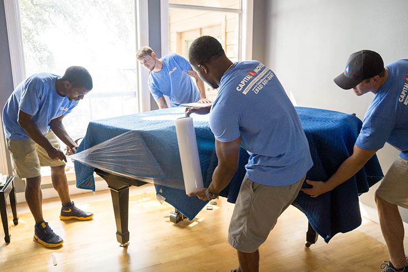 Packing-Labor-Four-Men-Capital-Movers-Texas-Movers-Wrap-Piano-Covered-Blanket-With-Plastic
